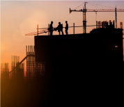 Construction silhouettes at sunset